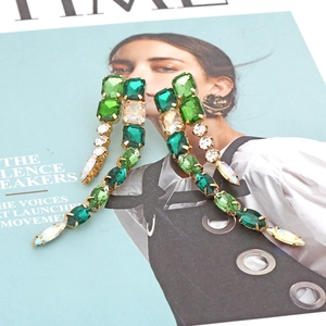 Green crystal tassel drop earrings with emerald and gold geometric rhinestones