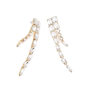 Detailed macro view of golden long tassel earrings with sparkling glass crystals