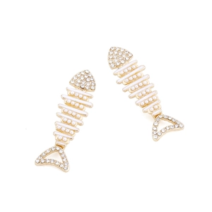 Creative fishbone earrings with golden alloy, rhinestones, and white pearls on white background