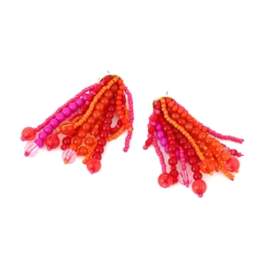 Bohemian handmade beaded tassel earrings with red and orange fringe in a fan shape