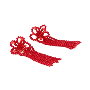 Detailed view of red glass crystal beaded floral tassel earrings with intricate hand weaving