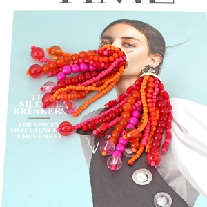 Bohemian colorful handmade beaded tassel earrings with vibrant orange and red long fringe