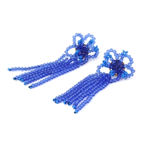 Detail of blue beaded tassel earrings featuring handmade woven flower design