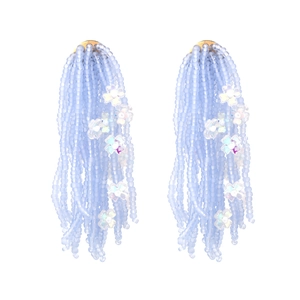 Handmade bohemian light blue beaded flower tassel drop earrings on white background
