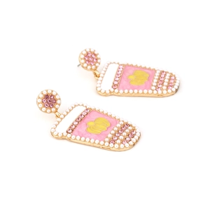 Exaggerated pink juice cup earrings with colorful crystals and pearls on white background