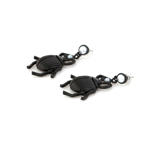 Creative black beetle earrings with textured finish and white faux pearl accents
