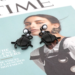 Retro beetle drop earrings with black enamel insect design and cream faux pearl accents