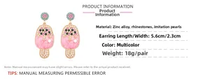 Detail of pink enamel ice cream earrings with colorful rhinestones and imitation pearls