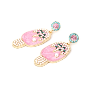 Detail of ice cream drop earrings with pink enamel and colorful rhinestones on gold alloy