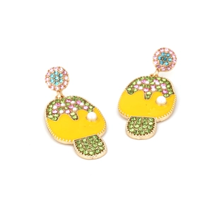 Detail of cartoon ice cream earring with colorful rhinestones and white pearl on gold alloy