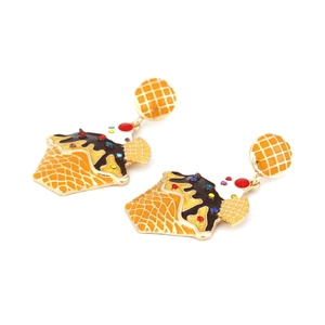 Detail view of ice cream cone earrings with colorful rhinestones and enamel finish