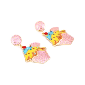 Detail of colorful enamel cupcake earrings with sparkly crystal rhinestones on gold metal