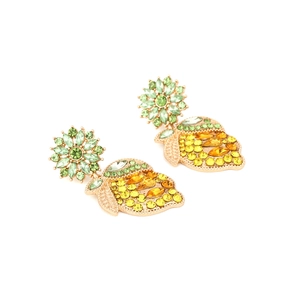 Macro shot of summer lemon drop earrings featuring yellow crystals and green flower studs