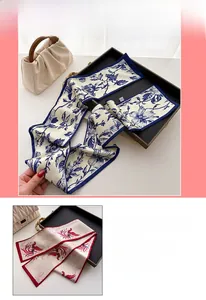 Detail of faux silk scarves with blue floral and red phoenix prints for neck or bag