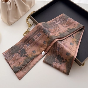 Detail of silk scarf with vintage Chinese landscape print on a black elegant tray