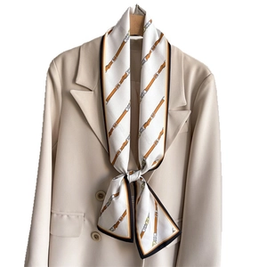 Retro equestrian pattern narrow silk scarf styled on a beige suit blazer accessory