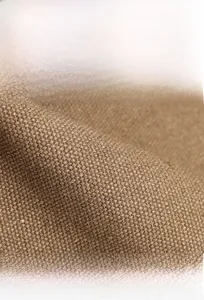 Close-up of durable brown canvas fabric showing texture for a lightweight shoulder bag