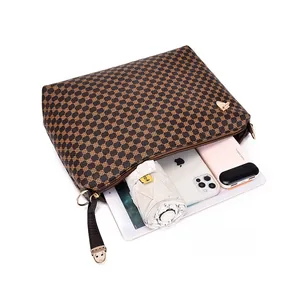 Detailed internal view of brown printed shoulder bag showing large capacity for essentials