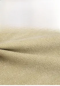 Close-up of durable beige canvas fabric texture showing fine weave on a large tote bag