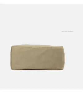 Detailed base view of canvas tote bag featuring reinforced stitching and smooth bottom design