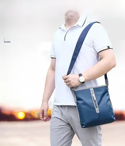 Detail of waterproof Oxford fabric with 6-strand stitching on blue men shoulder bag