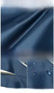 Waterproof navy oxford fabric texture and scratch-resistant test on durable shoulder bag