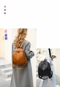 Elegante mochila de cuero aceitoso para mujer en negro y marrón, vista detallada.