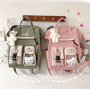 Detail of Korean style nylon backpack with bear charms and multi-pocket functional design