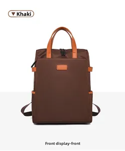 Vista frontale dello zaino porta pc kaki impermeabile con manici arancioni e tasca