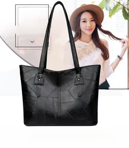 Détails du grand sac cabas noir en patchwork avec rivets en métal et coutures nylon