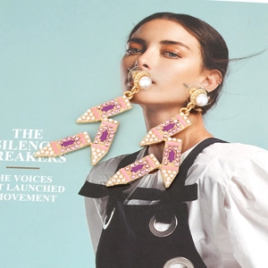 Bohemian pencil-shaped drop earrings with pink rhinestones, purple enamel, and pearls