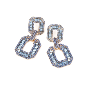 Detail of geometric double rectangle earrings with blue baguette cut rhinestones