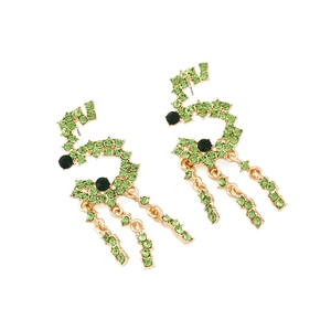 Detail of wave-shaped green crystal tassel earrings with gold-tone metal setting