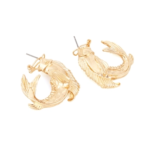Detailed close-up of golden vintage fish earrings with 3D embossed scales and fins