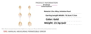 Detail card showing 10.5cm long gold flower fringe earrings with zinc alloy and pearls