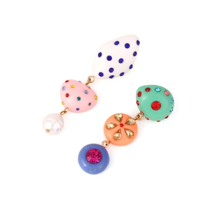 Detailed shot of asymmetric long resin earrings with colorful rhinestones and baroque pearl