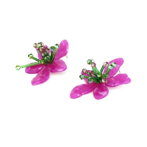 Macro detail of fuchsia acrylic flower earrings with green beaded core and marble texture