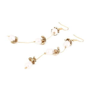 Elegant gold flower drop earrings with baroque pearls and leaf details in vintage style