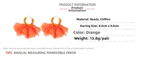 Detail view of orange bohemian chiffon flower earrings with dimensions and specifications