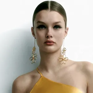 Chic oversized gold hollow floral drop earrings for women with layered petal design
