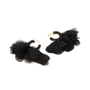 Detail of bohemian black chiffon flower earrings with handcrafted beadwork on gold hooks