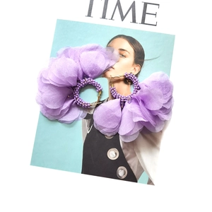 Bold Bohemian purple chiffon flower earrings with handcrafted beads on fashion magazine