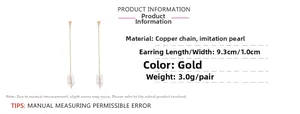 Detail of long gold chain earrings with irregular faux pearls and product dimensions