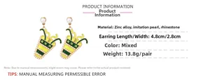 Detail view of milk tea cup earrings with dimensions 4.8x2.8cm and white pearl inlay