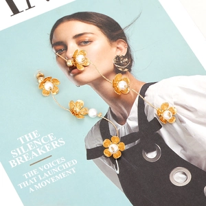 Elegant long gold floral tassel earrings with white pearls and brushed metal finish