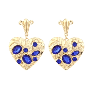Vintage gold textured heart earrings with blue crystal accents in a luxury style