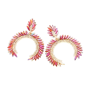 Detailed view of oversized golden C-shaped earrings with colorful AB marquise rhinestones