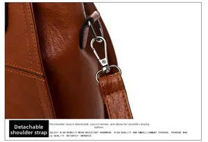 Detail view of silver hardware hook and removable strap on brown leather bag