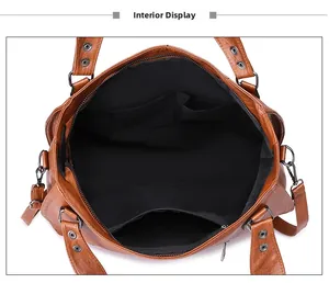 Internal display of the brown leather bag showing spacious compartments and zip pocket