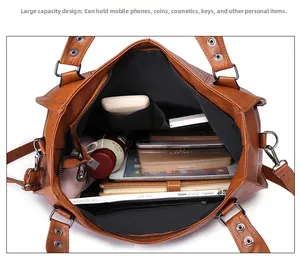 Large capacity tote interior with multiple pockets for phone, cosmetics and notebook